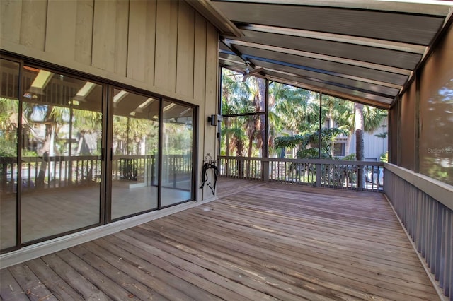 unfurnished sunroom with lofted ceiling