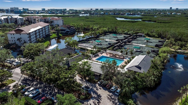 birds eye view of property with a water view