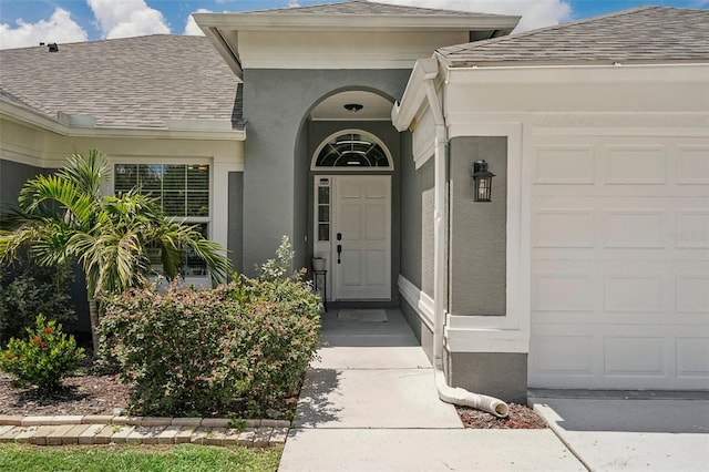 property entrance with a garage