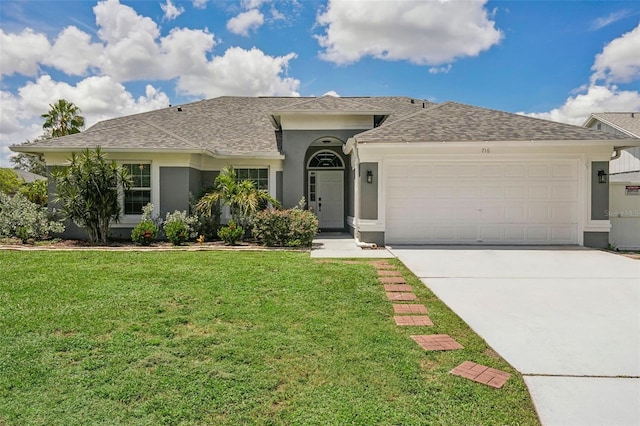 ranch-style home featuring a front yard and a garage