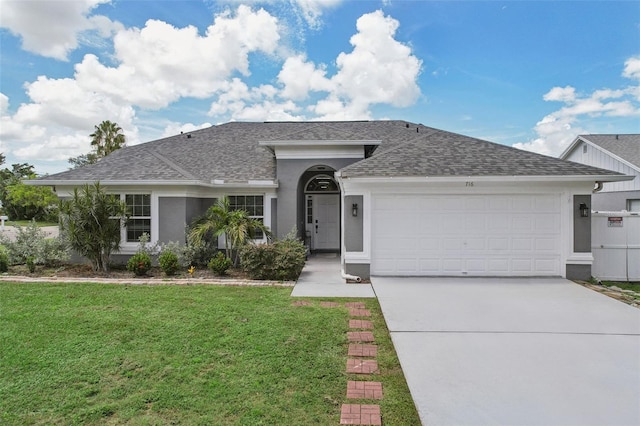 ranch-style home with a front yard and a garage