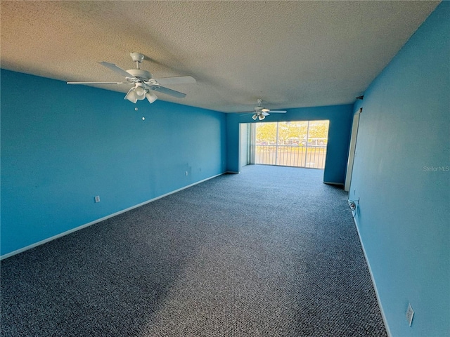 spare room with carpet flooring, a textured ceiling, and ceiling fan