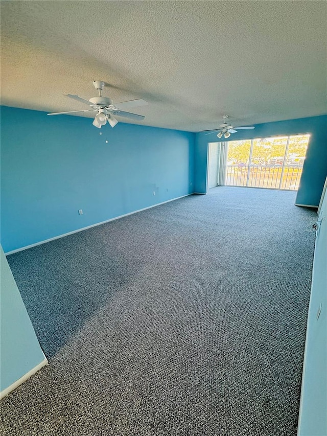 unfurnished room featuring carpet, ceiling fan, and a textured ceiling