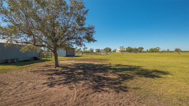 view of yard with a rural view