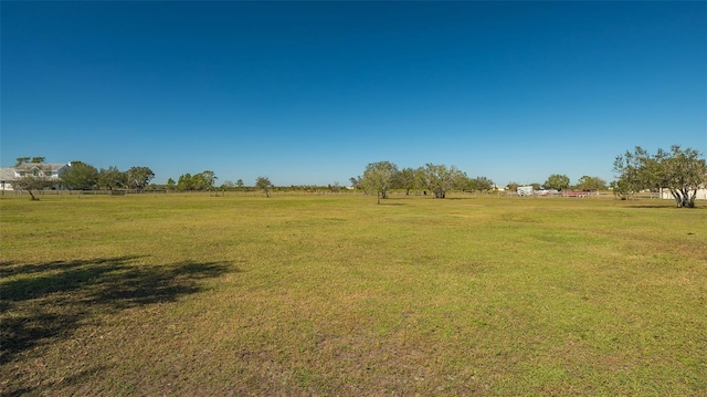 view of yard with a rural view