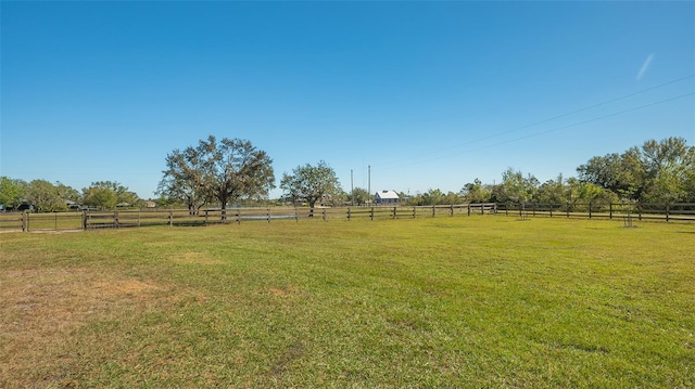 view of yard with a rural view