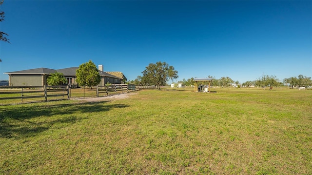 view of yard with a rural view