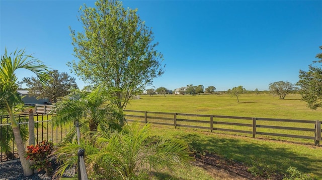 view of yard with a rural view