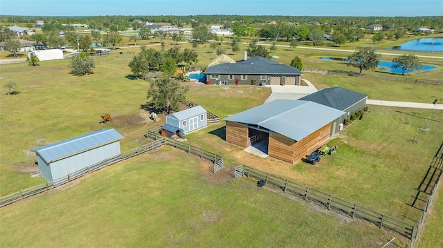 drone / aerial view with a water view and a rural view