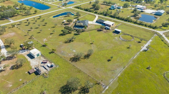 aerial view with a water view and a rural view