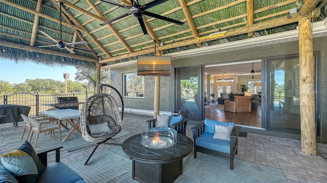 view of patio featuring a gazebo and an outdoor fire pit