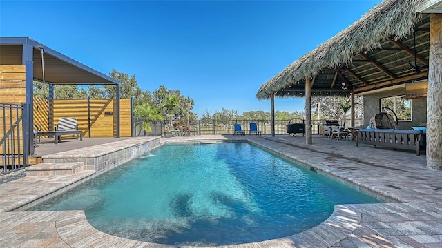 view of swimming pool featuring a gazebo, a patio, and pool water feature