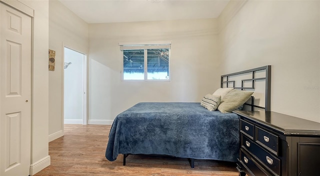 bedroom with wood-type flooring