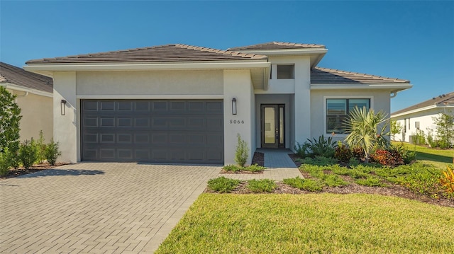 prairie-style home featuring a garage