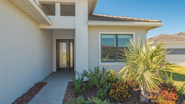 doorway to property featuring a garage