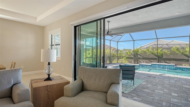 interior space with pool water feature and glass enclosure