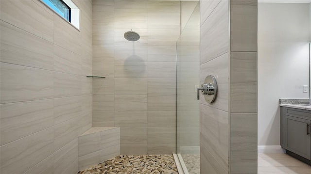 bathroom featuring vanity and a tile shower