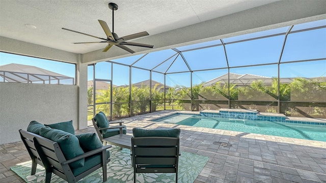 view of swimming pool with pool water feature, an outdoor living space, ceiling fan, and a patio