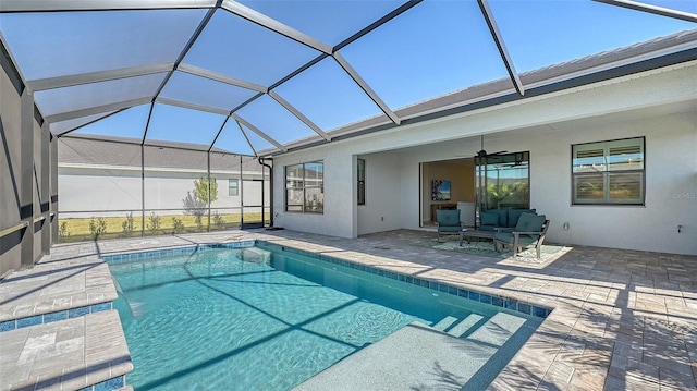 view of pool featuring a lanai, ceiling fan, a patio, and an outdoor living space