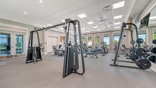 gym featuring french doors and a drop ceiling