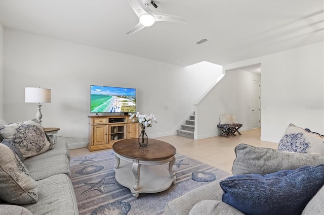 tiled living room featuring ceiling fan