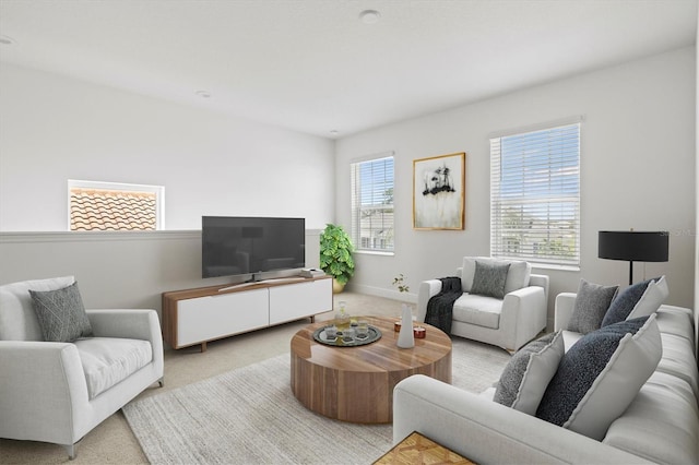 living room featuring a healthy amount of sunlight and light colored carpet