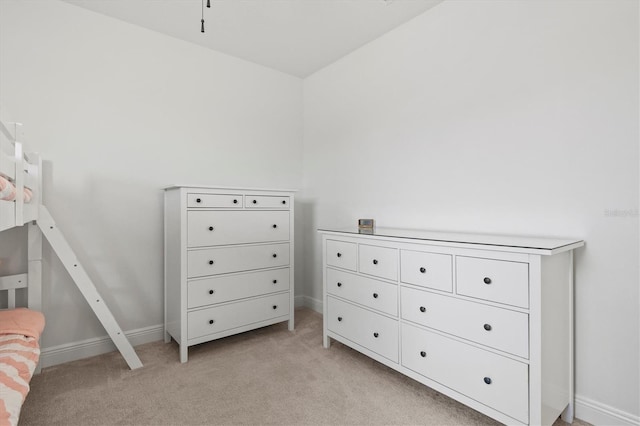 unfurnished bedroom featuring light colored carpet