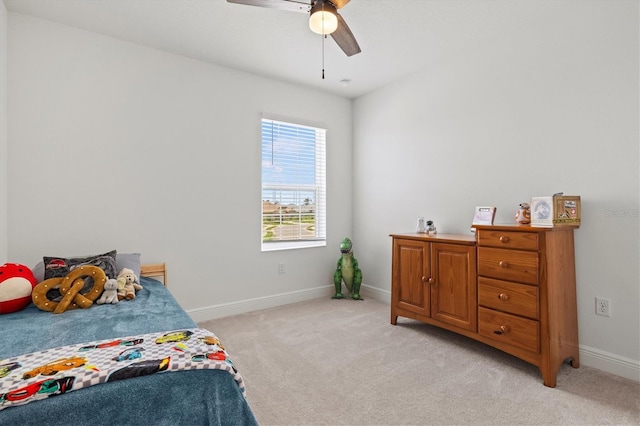 bedroom with ceiling fan and light colored carpet