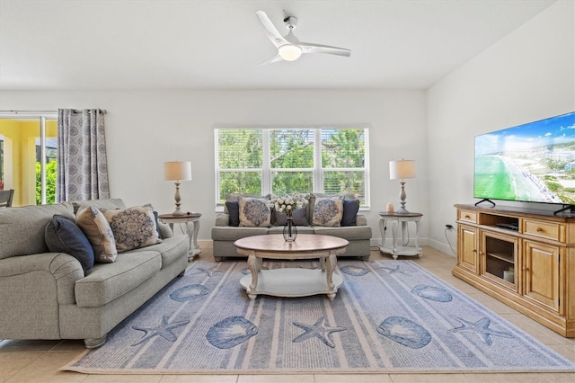 tiled living room with ceiling fan