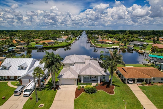 drone / aerial view with a residential view and a water view