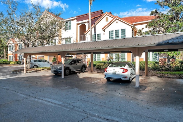 view of parking / parking lot with a carport