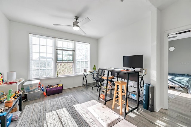 home office featuring ceiling fan and light wood-type flooring