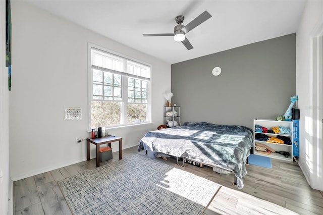 bedroom featuring light hardwood / wood-style floors and ceiling fan