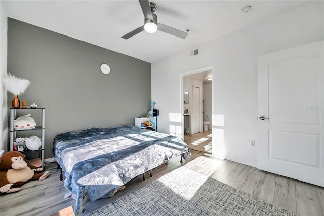 bedroom featuring light hardwood / wood-style floors and ceiling fan