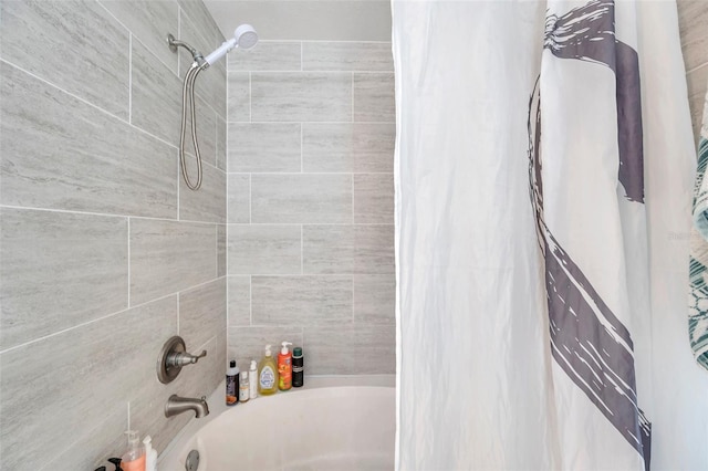 bathroom with shower / bathtub combination with curtain