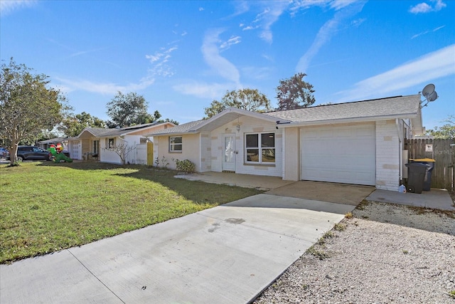 single story home featuring a garage and a front yard