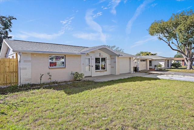 ranch-style home with a front yard and a garage