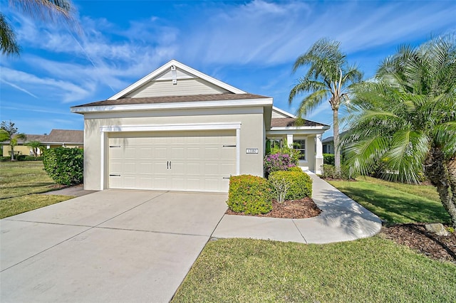 view of front of home featuring a front yard and a garage