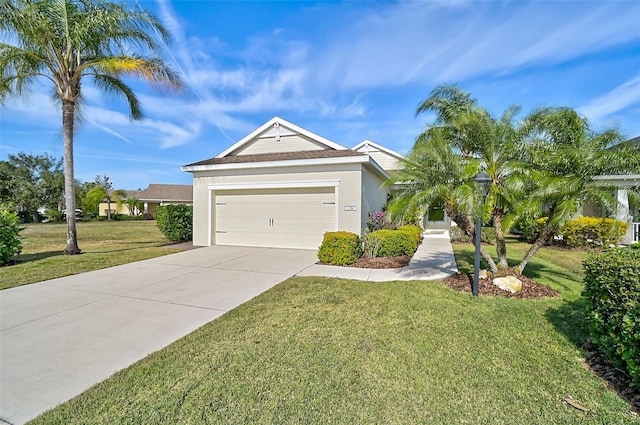 view of front of property with a garage and a front lawn