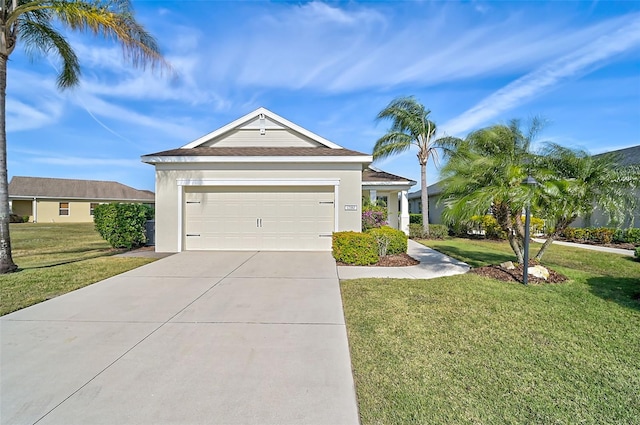 view of front of house with a garage and a front lawn