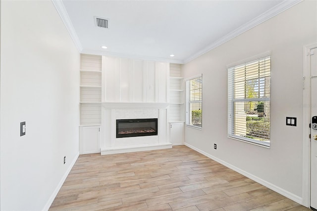 unfurnished living room featuring light wood-type flooring and ornamental molding