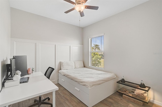 bedroom featuring dark hardwood / wood-style floors and ceiling fan