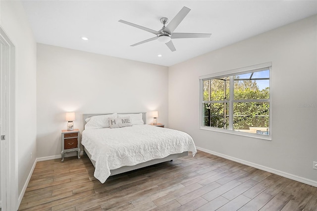 bedroom featuring hardwood / wood-style flooring and ceiling fan