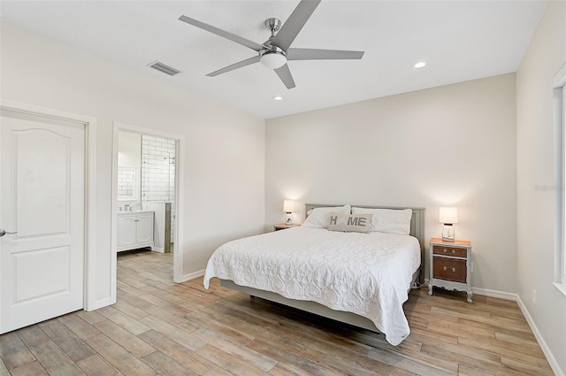 bedroom with connected bathroom, ceiling fan, and light hardwood / wood-style floors