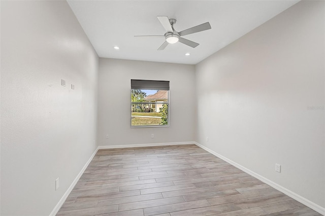 unfurnished room featuring ceiling fan and light hardwood / wood-style flooring