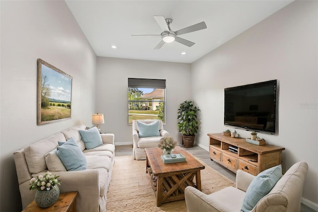 living room with ceiling fan and light wood-type flooring