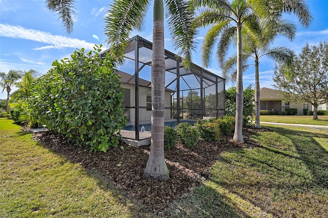 view of yard featuring glass enclosure