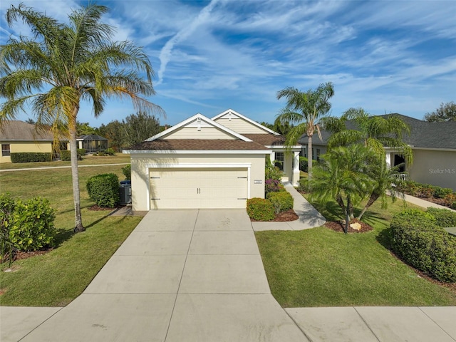 view of front facade featuring a front yard and a garage