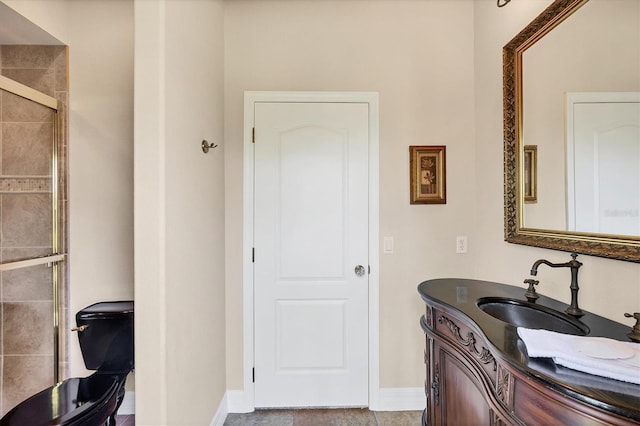 bathroom with tile patterned flooring, vanity, and a shower with shower door