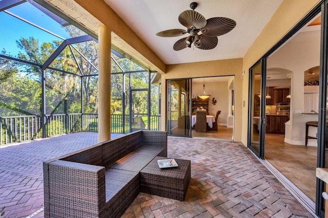 sunroom / solarium with ceiling fan